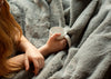 Woman drinking coffee in bed