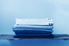 A stack of folded pillowcases